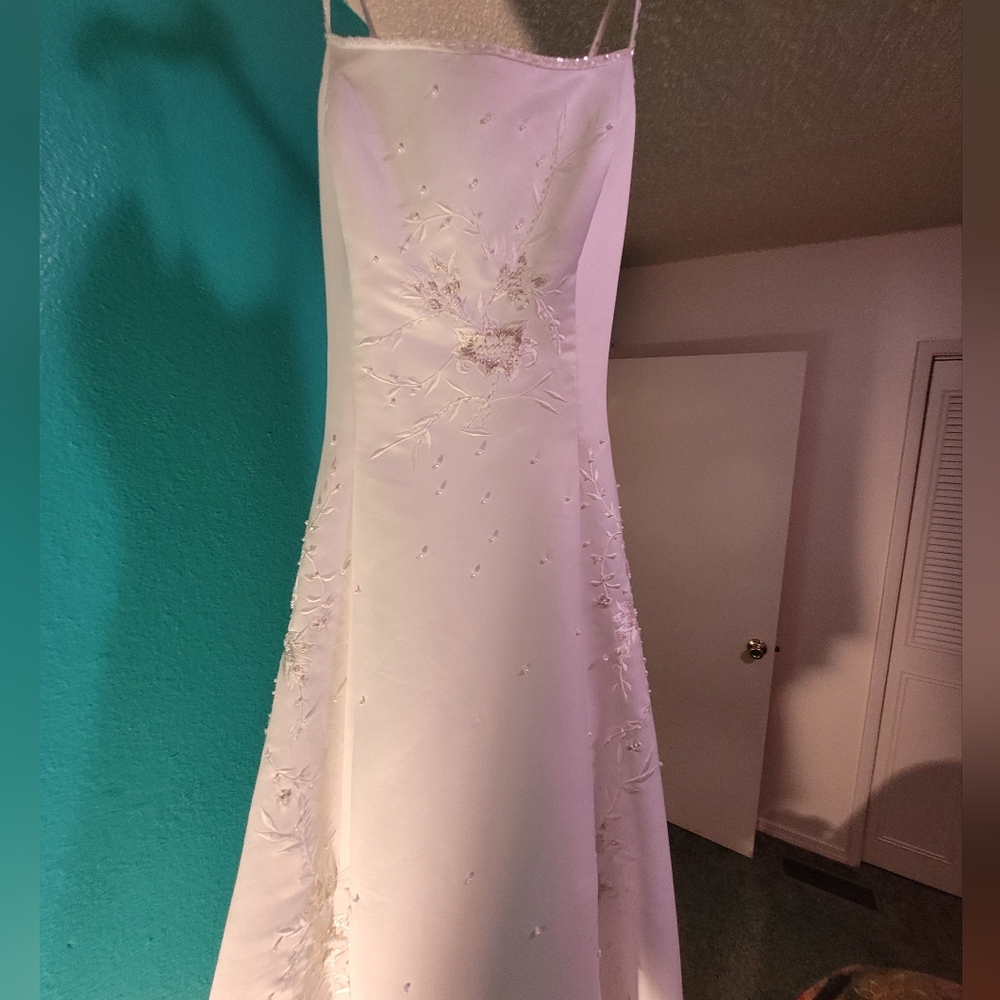 Elegant White Gown with Floral Embroidery, Pearl Beading And Sequined Stitching.